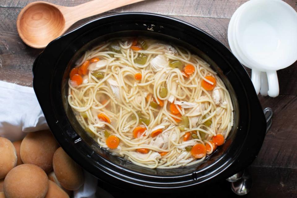 <p>The Magical Slow Cooker</p><p>A classic chicken noodle soup recipe but made with spaghetti noodles instead of egg noodles.</p><p><strong>Get the Recipe: <a href="https://www.themagicalslowcooker.com/slow-cooker-chicken-noodle-soup/" rel="nofollow noopener" target="_blank" data-ylk="slk:Crock Pot Chicken Noodle Soup Recipe;elm:context_link;itc:0;sec:content-canvas" class="link ">Crock Pot Chicken Noodle Soup Recipe</a></strong></p>