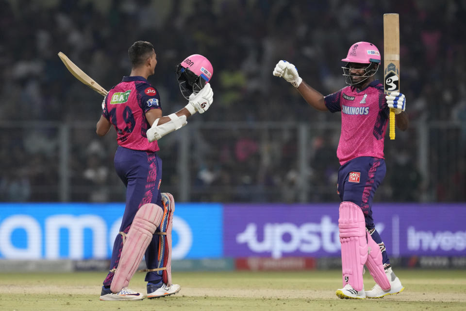 Rajasthan Royals' captain Sanju Samson , right, and batting partner Yashasvi Jaiswal celebrate after their win in the Indian Premier League cricket match against Kolkata Knight Riders in Kolkata, India, Thursday, May 11, 2023. (AP Photo/Bikas Das)