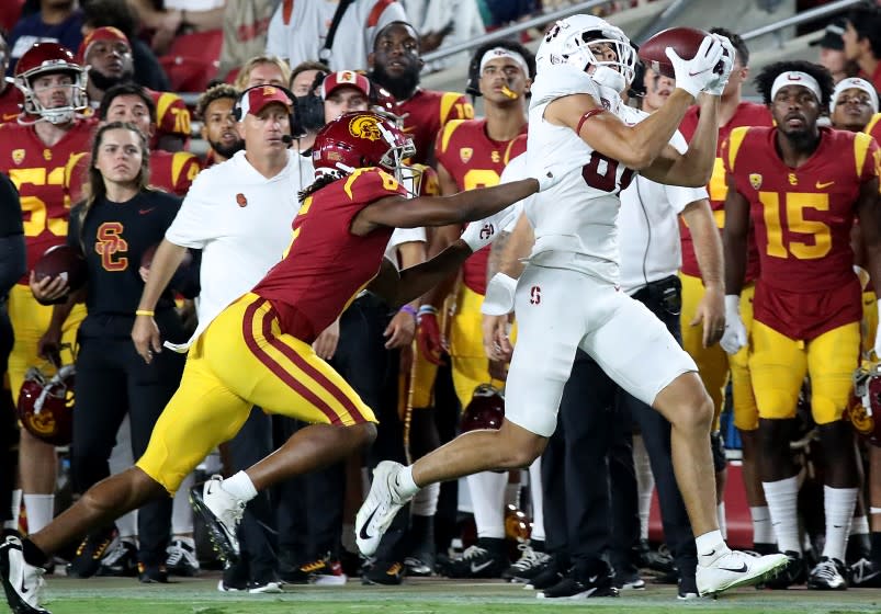 LOS ANGELES, CALIF. - SEP 11, 2021. Stanford wide receiver Brycen Tremayne makes a catch against USC cornerback Chris Steele during a win against the Trojansat the Coliseum on Saturday night, Sep. 11, 2021. (Luis Sinco / Los Angeles Times)