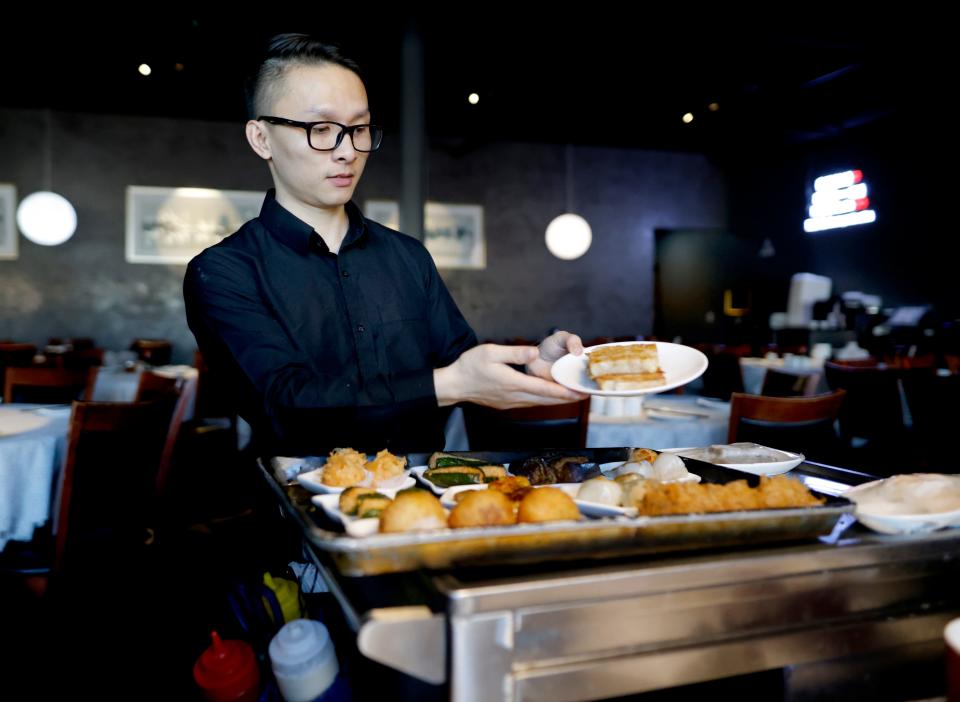 My Nguyen serves dim sum on Sept. 8 at the Golden Phoenix.