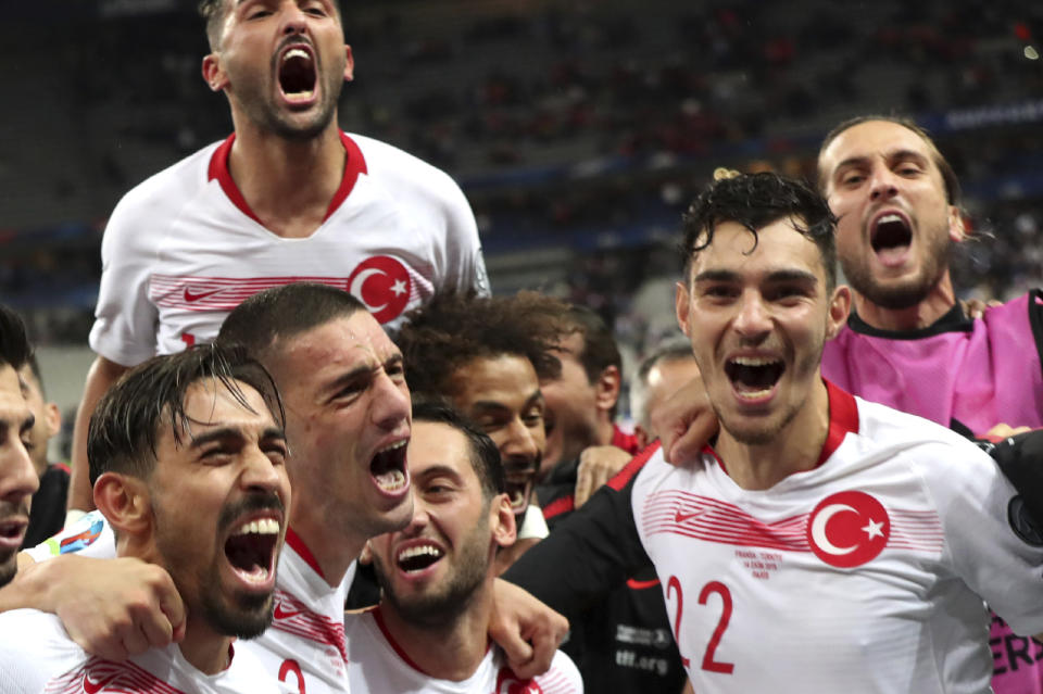 Turkey players celebrated after the end of the Euro 2020 group H qualifying soccer match between France and Turkey at Stade de France at Saint Denis, north of Paris, France, Monday, Oct. 14, 2019. The match ended 1-1. (AP Photo/Thibault Camus)