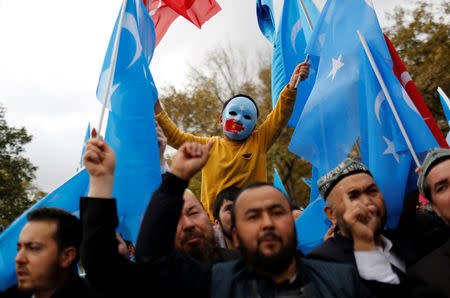 A masked Uighur boy takes part in a protest against China, at the courtyard of Fatih Mosque, a common meeting place for pro-Islamist demonstrators in Istanbul, Turkey, November 6, 2018. REUTERS/Murad Sezer