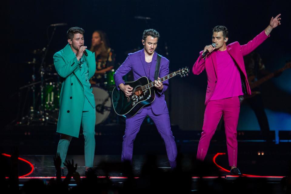 Nick Jonas, from left, Kevin Jonas and Joe Jonas, shown performing in 2019 in Washington, D.C.