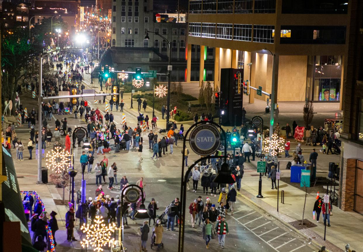 Thousands of people walk around downtown during Stroll on State on Saturday, Nov. 26, 2022, in Rockford.