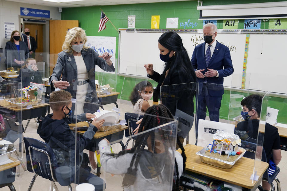 President Joe Biden, first lady Jill Biden and fifth-grade teacher Cindy Bertamini, watch a student demonstrate his project, during a visit to Yorktown Elementary School, Monday, May 3, 2021, in Yorktown, Va. (AP Photo/Evan Vucci)