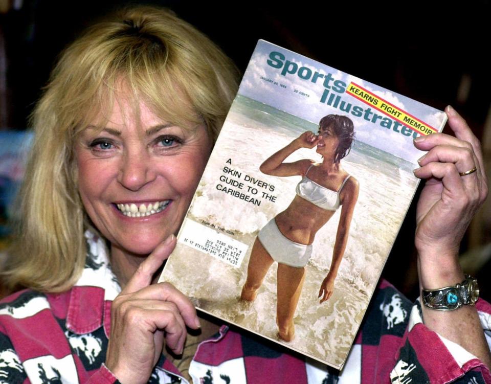 Babette Beatty holds the Jan. 20, 1964, Sports Illustrated in which she graces the cover of the magazine's first swimsuit edition at her Halfway, Ore., business Jan. 19, 2000. The German-born beauty, who was an internationally known model, romping across the covers of the world's top fashion magazines and partying with the likes of Andy Warhol and Mick Jagger, now lives a more sedate lifestyle in the high desert eastern town.
