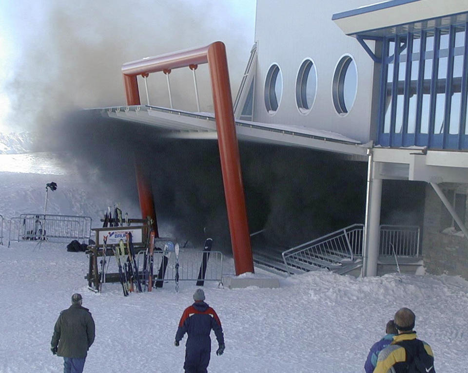 FILE - Smoke pours from the upper mouth of the tunnel up the Kitzsteinhorn, Mountain, Austria, on Nov. 11, 2000, where a cable car caught fire killing some 170 snowboarders and skiers, many of them children or teenagers. Rail travel in Europe is a common and relatively affordable and convenient way for many Europeans to travel. It also has a good safety record overall, growing safer in past years. Yet the tragedy in Greece on Wednesday is a reminder of how deadly crashes can be when they happen. (AP Photo/Georg Koechler, File)