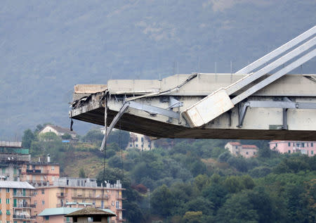 The collapsed Morandi Bridge is seen in the Italian port city of Genoa, Italy August 14, 2018. REUTERS/Stefano Rellandini