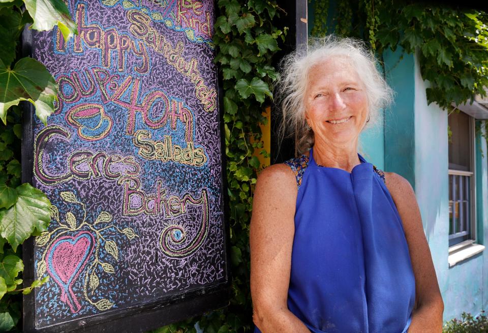 Penny Brewster is seen in 2020 in front of Ceres Bakery, which she opened in 1980. She has been chosen as the grand marshal for the 2023 Portsmouth Halloween Parade.