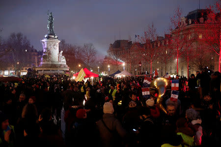 Protesters wearing yellow vests gather at the Place de la Republique for a so-called "yellow night" by the "yellow vests" movement in Paris, France January 26, 2019. REUTERS/Benoit Tessier