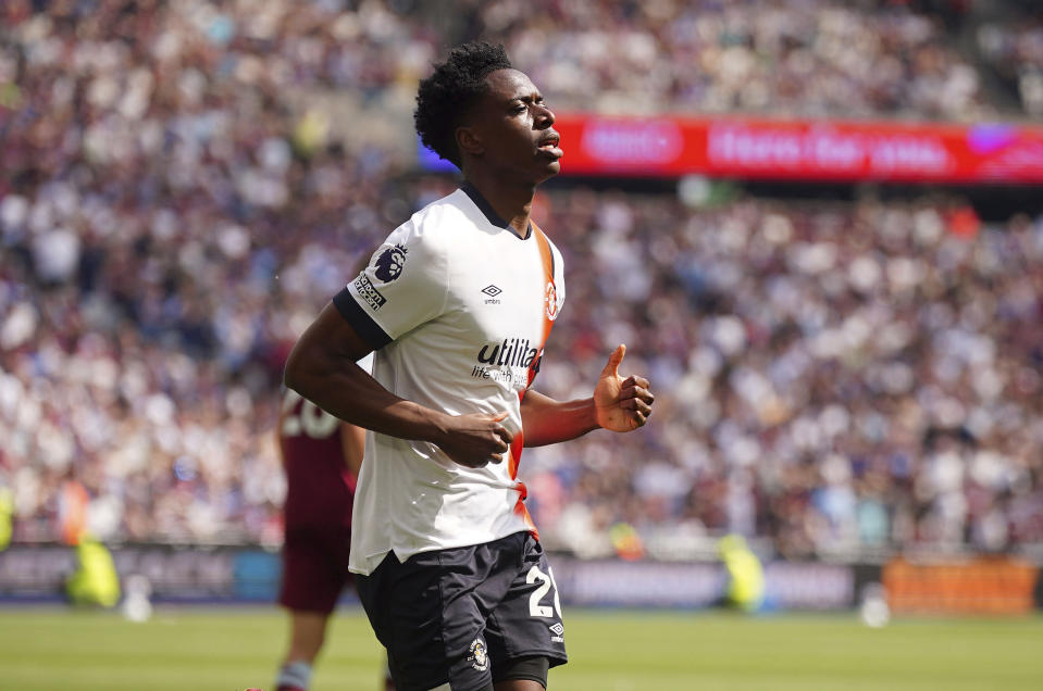 Luton Town's Albert Sambi Lokonga celebrates scoring his side's first goal of the game during the English Premier League soccer between West Ham United and Luton Town match at the London Stadium, London, Saturday May 11, 2024. (Victoria Jones/PA via AP)