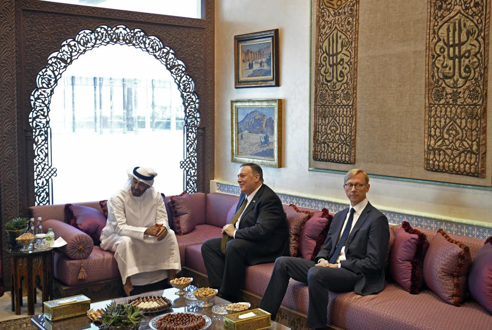 U.S. Secretary of State Mike Pompeo, center, meets with Abu Dhabi Crown Prince Mohamed bin Zayed al-Nahyan in Abu Dhabi, United Arab Emirates, Thursday, Sept. 19, 2019, as U.S. special representative on Iran Brian Hook, right, listens. (Mandel Ngan/Pool via AP)