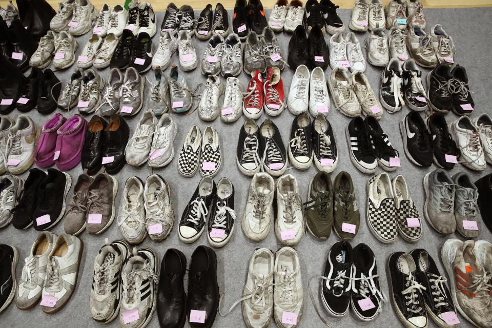 The belongings of victims of the deadly Halloween celebration stampede are shown at a gym on 1 November 2022 in Seoul, South Korea (Getty Images)