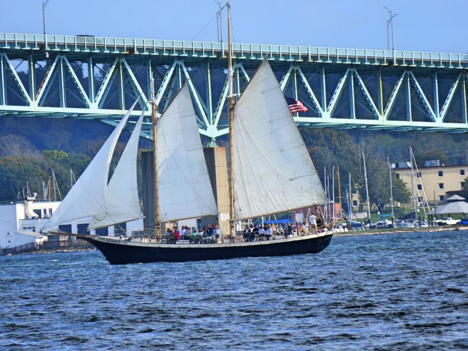 A boat sails on Newport Harbor.