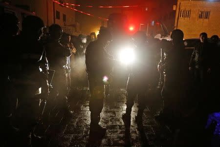 Jordanian policemen operate in the vicinity of Karak Castle, where armed gunmen carried out an attack, in the city of Karak, Jordan, December 18, 2016.REUTERS/Muhammad Hamed