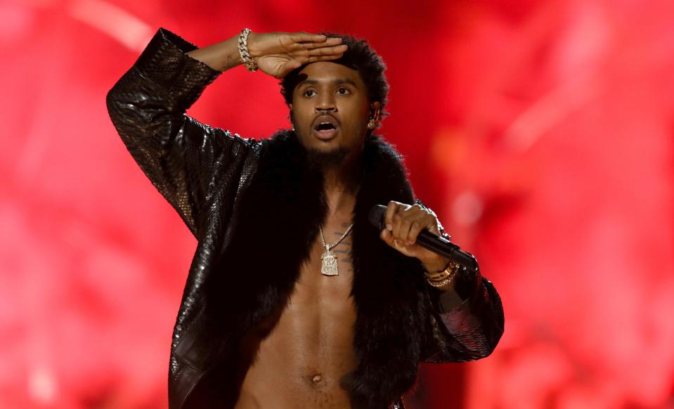 FILE - In this June 25, 2017 file photo, Trey Songz performs at the BET Awards at the Microsoft Theater in Los Angeles. Police say the R&B singer has been arrested on suspicion of felony domestic violence for punching a woman at a Los Angeles party.  LAPD spokesman Officer Drake Madison says the 33-year-old whose real name is Tremaine Neverson turned himself in at a Hollywood police station Monday morning, March 19, 2018. Jail records show Songz was released about two hours later on $50,000 bail.  (Photo by Matt Sayles/Invision/AP, File) ORG XMIT: NYCD104