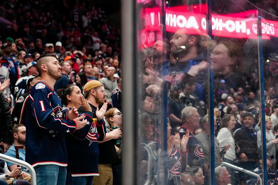 Fans celebrate a goal by Blue Jackets left wing James Malatesta during a 6-3 win over the Hurricanes in Columbus' season finale.