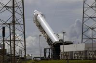 Space Exploration Technologies' Falcon 9 rocket is prepared for a launch attempt from Space Launch Complex 40 at the Cape Canaveral Air Force Station in Cape Canaveral, Florida October 7, 2012. REUTERS/Michael Brown/Files