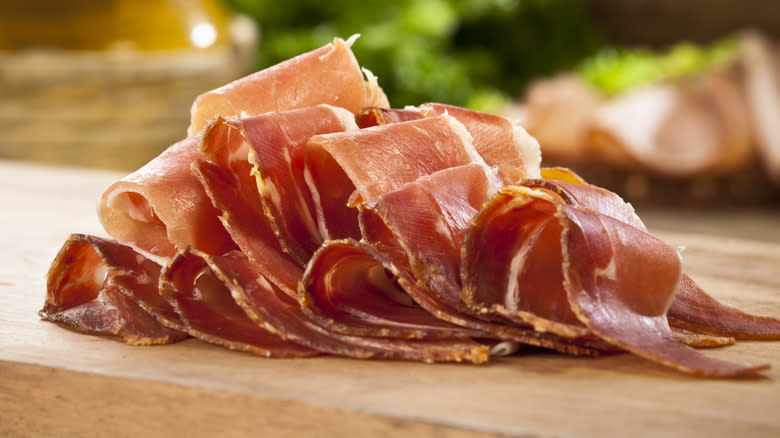 slice of prosciutto on a cutting board