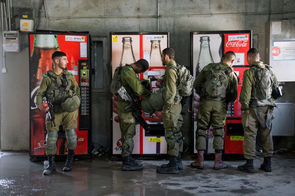 Israeli soldiers buying cold drinks during an urban warfare exercise at an army training facility at the Zeelim army base, southern Israel, Jan. 4, 2022.