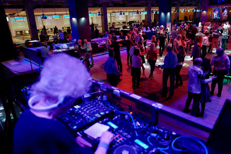 DJ Wika Szmyt, 80, plays music at a club in Warsaw, Poland March 25, 2019. Picture taken March 25, 2019. REUTERS/Kacper Pempel