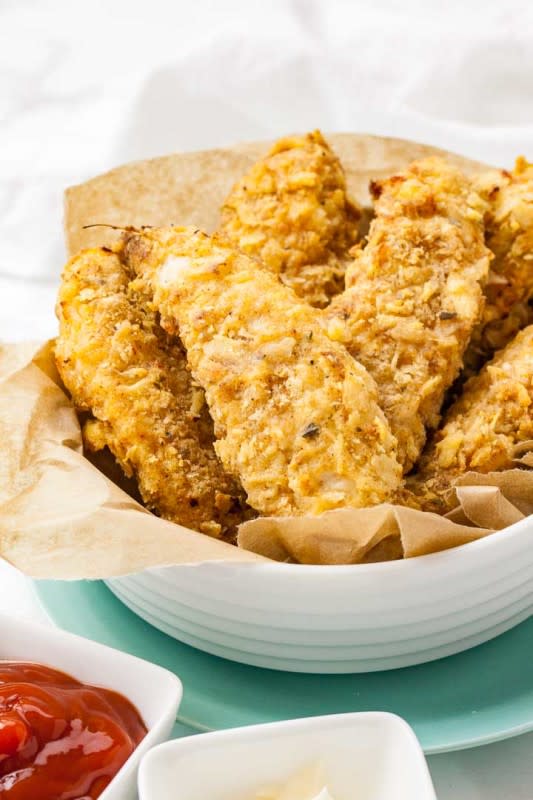 <p>Air Fryer Chicken Tenders are crispy on the outside and juicy on the inside! These homemade breaded chicken strips are marinated in buttermilk to make them extra tender and have a crispy flavorful crust seasoned with a KFC-copycat spice mix.</p><p><strong>Get the recipe: <a href="https://platedcravings.com/air-fryer-chicken-tenders/" rel="nofollow noopener" target="_blank" data-ylk="slk:Air Fryer Chicken Tenders;elm:context_link;itc:0;sec:content-canvas" class="link rapid-noclick-resp">Air Fryer Chicken Tenders</a></strong></p>