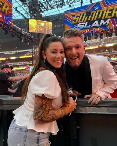 <p>Samantha McAfee Instagram</p> Pat McAfee takes a photo with his wife, Samantha McAfee, while at a WWE event.