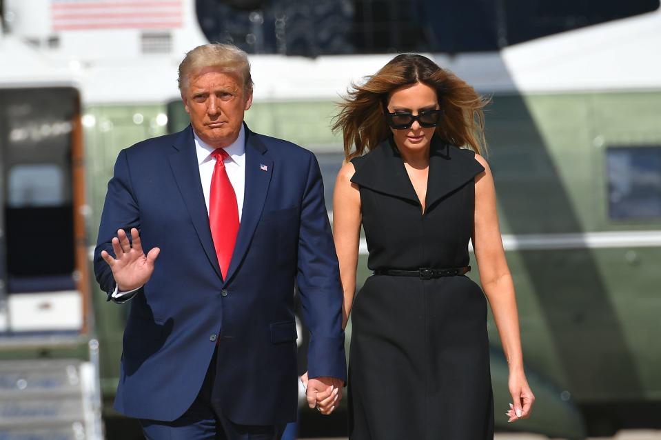 US President Donald Trump and First Lady Melania Trump arrive to board Air Force One at Joint Base Andrews in Maryland on October 22, 2020. - President Trump travels to Nashville, Tennessee, for the final presidential debate.