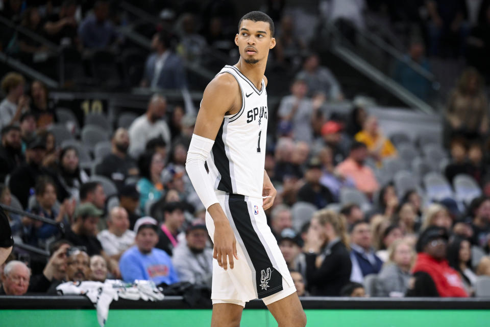 San Antonio Spurs' Victor Wembanyama walks up the court during the first half of a preseason NBA basketball game against the Houston Rockets, Wednesday, Oct. 18, 2023, in San Antonio. San Antonio won 117-103. (AP Photo/Darren Abate)