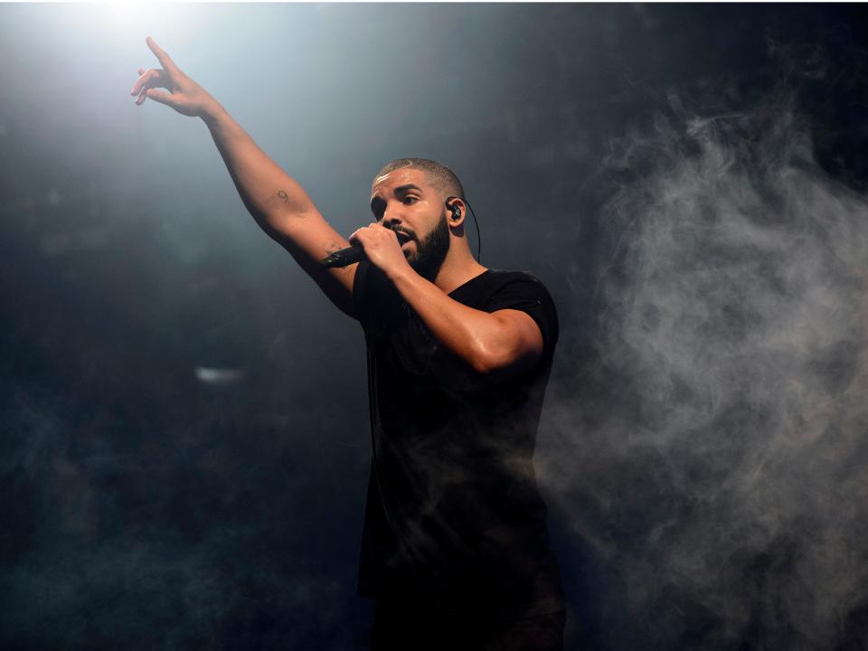 FILE - In this June 27, 2015 file photo, Canadian singer Drake performs on the main stage at Wireless festival in Finsbury Park, London.  Drake has landed his 208th song on the Billboard Hot 100 chart, setting a new record for most songs on the music chart. The rapper's latest track, “Oprah's Bank Account" with DaBaby and Lil Yachty, debuted at No. 89 on the Hot 100 chart this week and helps Drake surpass the 207-song run the cast of “Glee" held on the chart. (Photo by Jonathan Short/Invision/AP, File)
