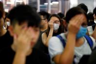 Protest at Yuen Long MTR station, the scene of an attack by suspected triad gang members a month ago