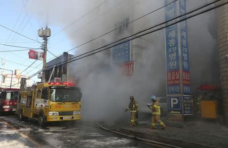 Smoke rises from a burning hospital in Miryang, South Korea, January 26, 2018. Kim Dong-min/Yonhap via REUTERS