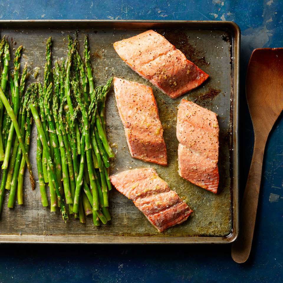 <p>Looking for a recipe to help you eat more heart-healthy fish and veggies? Add this salmon and asparagus dinner to your rotation. Not only is it healthy and delicious, this sheet-pan dinner is also easy to make and a breeze to clean up. <a href="https://www.eatingwell.com/recipe/262919/salmon-asparagus-with-lemon-garlic-butter-sauce/" rel="nofollow noopener" target="_blank" data-ylk="slk:View Recipe" class="link ">View Recipe</a></p>