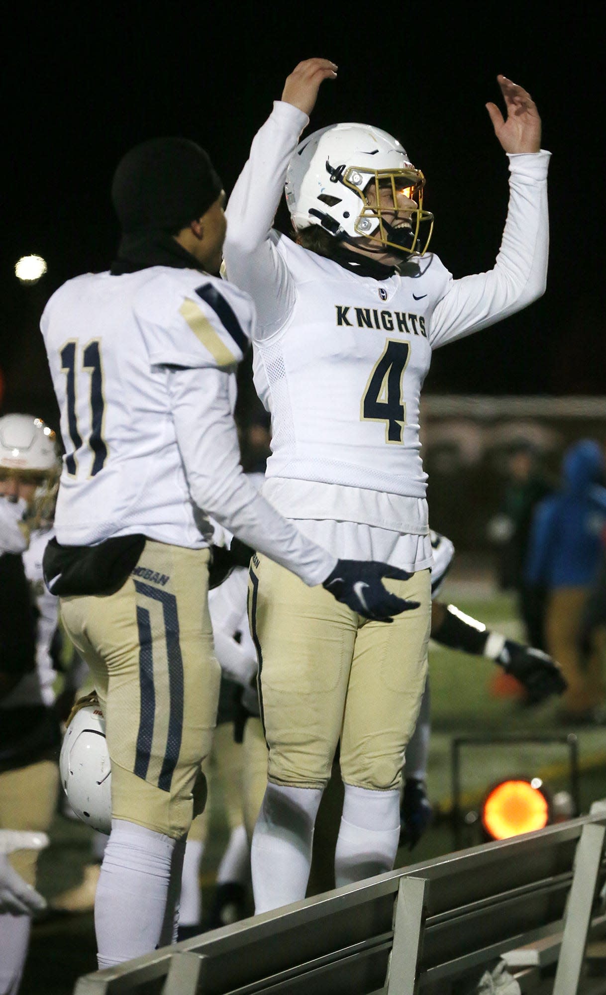 Archbishop Hoban's Tyson Campbell and Charlie Durkin encourage their fans in the final minutes of the Division II state semifinal football game against Avon at Byers Field in Parma. Hoban beat Avon 31 to 24.