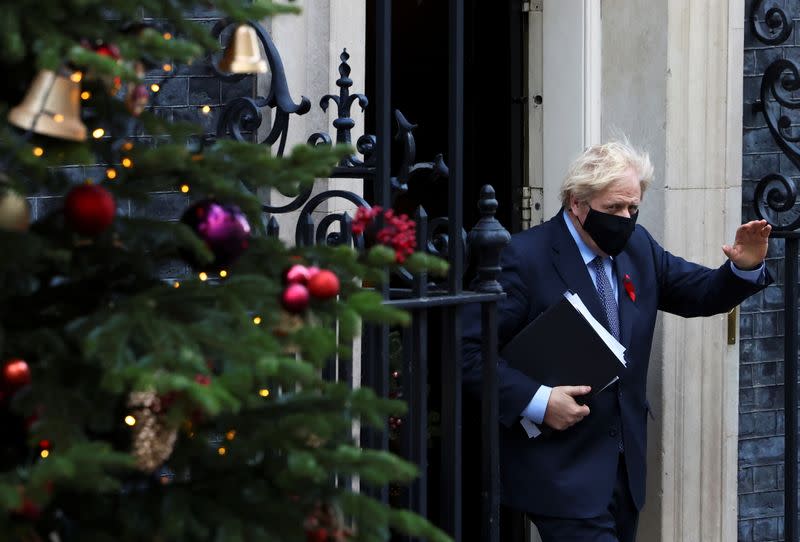 Britain's Prime Minister Boris Johnson waves as he leaves Downing Street, in London