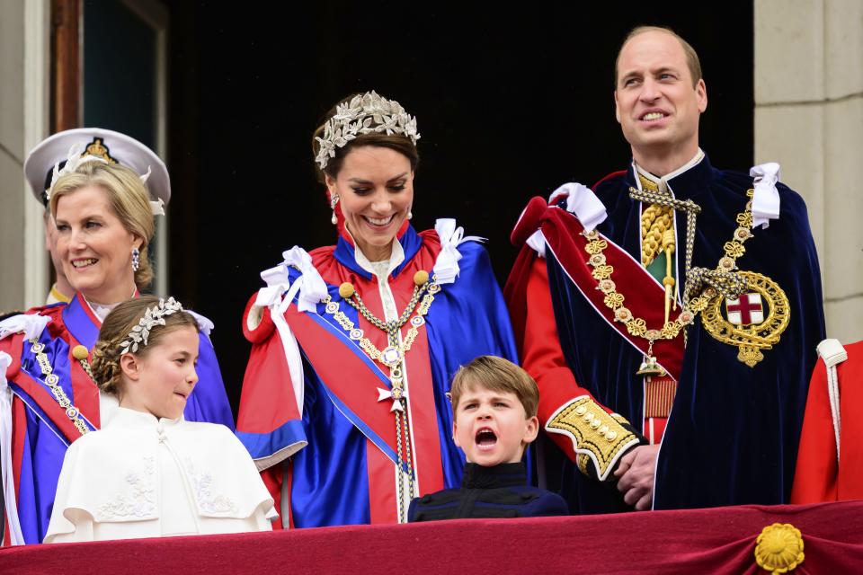 Sophie, Duchess of Edinburgh, Kate, Princess of Wales and Prince William stand on the balcony of Buckingham Palace with Princess Charlotte and Prince Louis during the coronation of Britain’s King Charles III, in London.