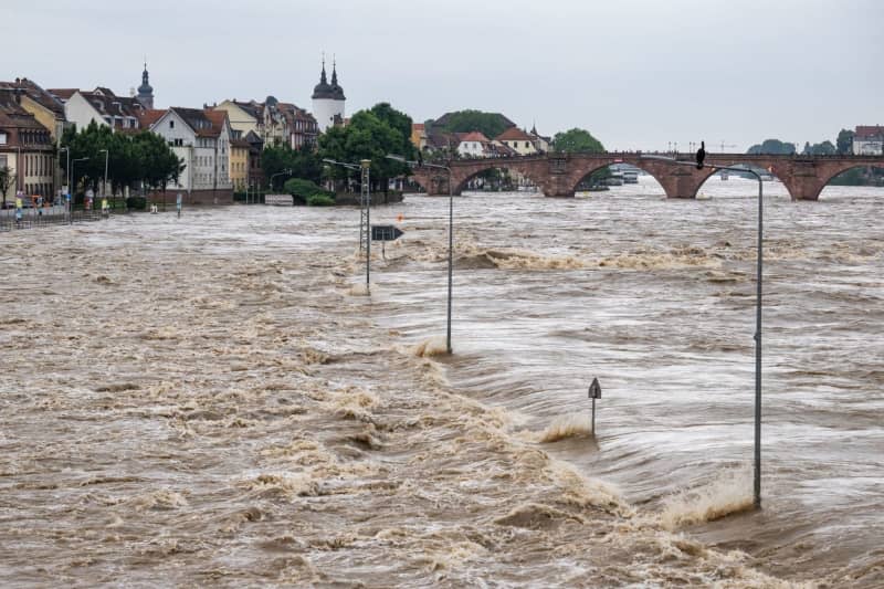 The River Neckar burst its banks near the historic old town of Heidelberg during a major flood.  Boris Roessler/dpa
