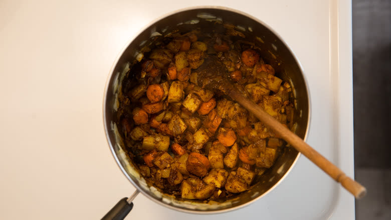 spicy vegetables cooking in saucepan