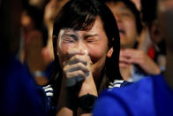 <p>Japanese fan reacts as she watches a broadcast of the World Cup Round of 16 soccer match Belgium vs Japan at a sports bar in Tokyo, Japan July 3, 2018. REUTERS/Issei Kato </p>