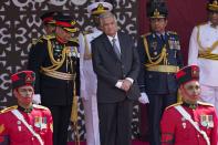 Sri Lankan president Ranil Wickremesinghe prepares to leave after the 75th Independence Day ceremony as from left, chief of defence staff Gen. Shavendra Silva, army commander Gen. Vikum Liyange, navy commander Vice Admiral Priyantha Perera, airforce commander Air Marshal Sudarshana Pathirana and police chief Chandana Wickremeratne salute during the 75th Independence Day ceremony in Colombo, Sri Lanka, Saturday, Feb. 4, 2023. Sri Lanka marks the anniversary of independence from British colonial rule on Feb. 4 each year. (AP Photo/Eranga Jayawardena)