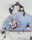 Amanda Kessel (28) celebrates with teammate Brianna Decker of the Untied States (14) after scoring a goal on Goalkeeper Florence Schelling of Switzerland (41) during the third period of the 2014 Winter Olympics women's ice hockey game at Shayba Arena, Monday, Feb. 10, 2014, in Sochi, Russia. (AP Photo/Matt Slocum )