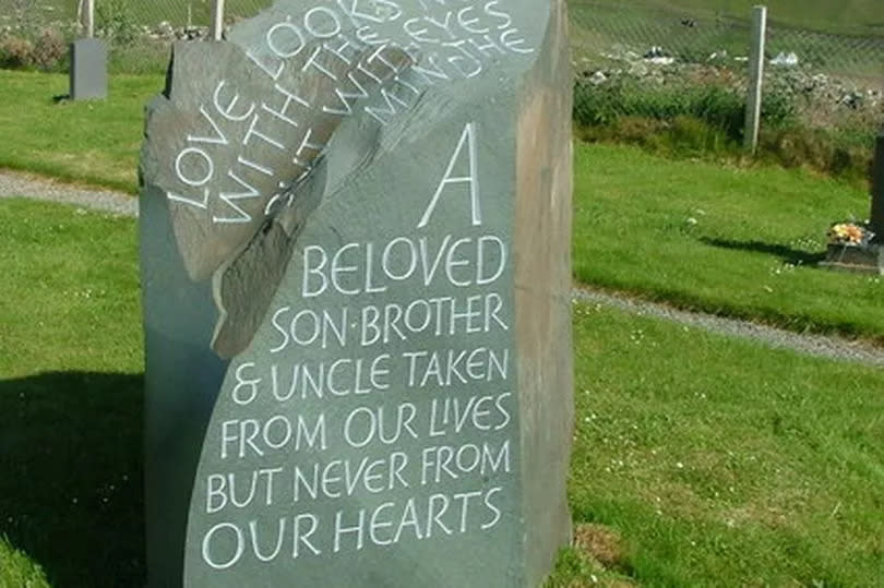 Rear view of the memorial stone to Alexander McQueen