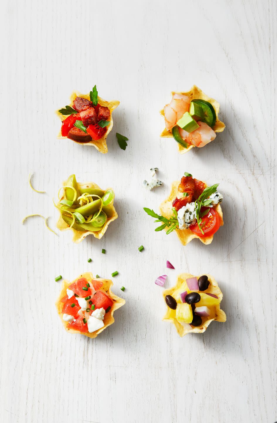 <p>This no-bake snack features tons of topping combo ideas for tortilla chip cups. So easy.</p><p>Get the <a href="https://www.goodhousekeeping.com/food-recipes/a35191279/stuffed-tortilla-cups-recipe/" rel="nofollow noopener" target="_blank" data-ylk="slk:Stuffed Tortilla Cups recipe;elm:context_link;itc:0;sec:content-canvas" class="link "><strong>Stuffed Tortilla Cups recipe</strong></a>.</p>