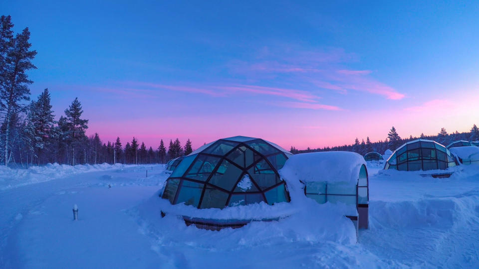 Lapland, Finland - March 2017:Glass igloo village at snowy Kakslauttanen Arctic Resort, Finland. Igloos for watching northern lights during the polar night in winter. Luxury tourist resort in Lapland