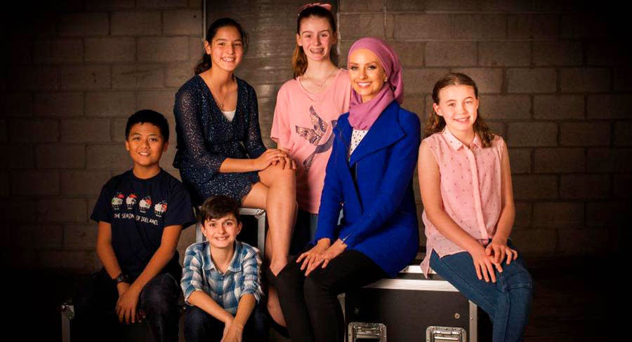 A photo of Dr Susan Carland with season one's Child Genius contestants.