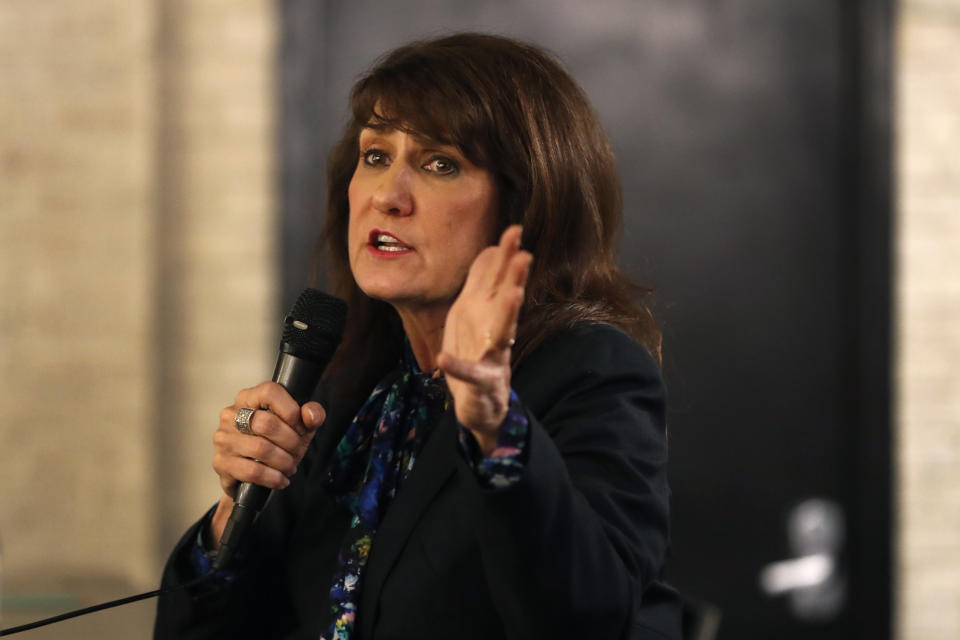 In this Monday, March 9, 2020, photo, Marie Newman smiles as she campaigns in the Archer Heights neighborhood of Chicago. Newman almost unseated Illinois Republican Rep. Dan Lipinski a staunch abortion opponent and one of the most conservative Democrats in Congress, in 2018, and is trying again in the March 17 primary. (AP Photo/Charles Rex Arbogast)