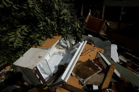 A damaged refrigerator is seen near a house destroyed by a mudslide after Storm Nate in the outskirts of San Jose, Costa Rica October 6, 2017. REUTERS/Juan Carlos Ulate