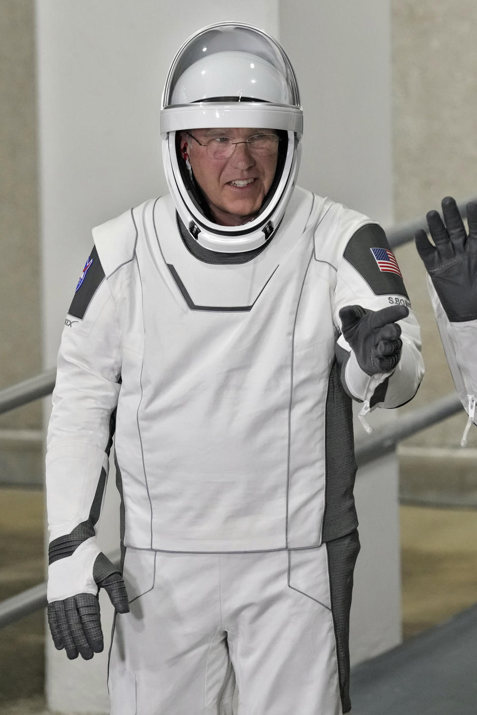 Commander Stephen Bowen points at family members as he poses for a photo after leaving the Operations and Checkout building for a trip to Launch Pad 39-A, Wednesday, March 1, 2023, at the Kennedy Space Center in Cape Canaveral, Fla. Four astronauts are scheduled to liftoff early Thursday morning on a trip to the International Space Station. (AP Photo/John Raoux)