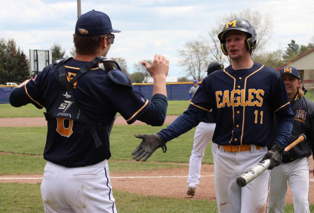 Cole Kreger (left) congratulates Erie Mason teammate Vaughn Brown on Saturday, April 20, 2024.