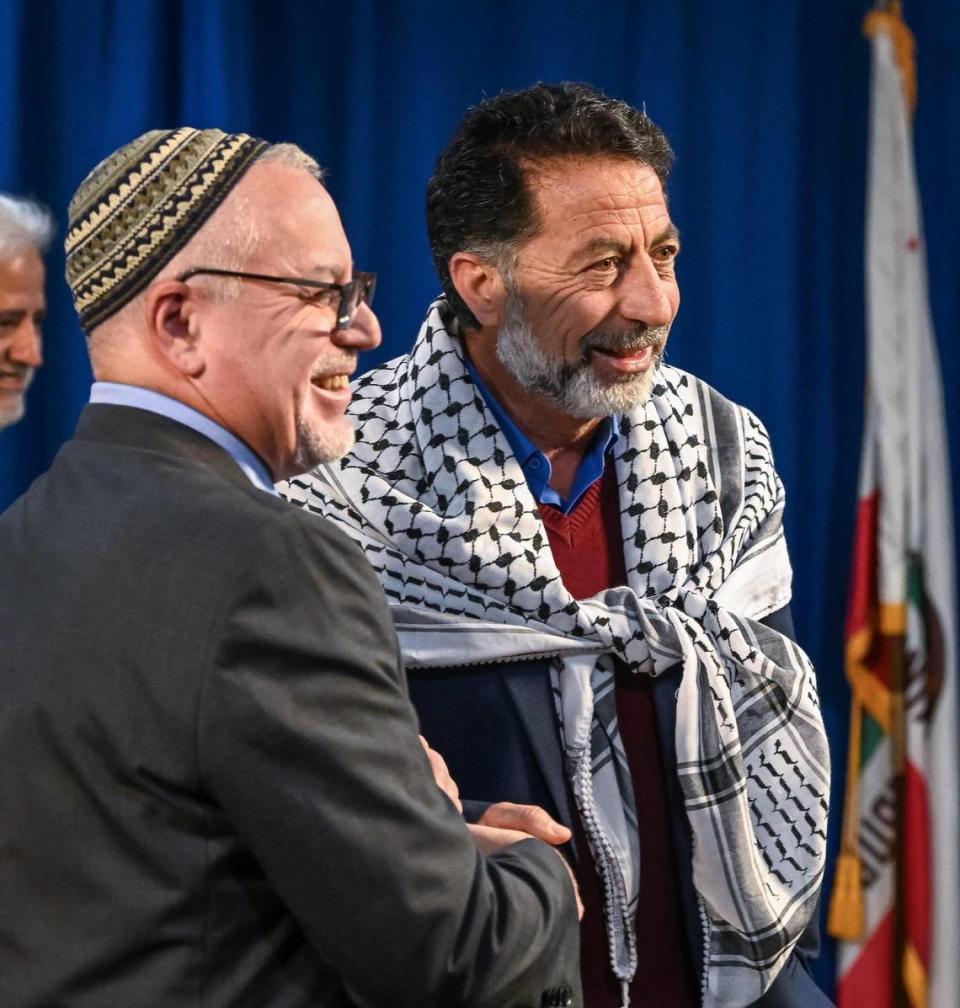 Rabbi Rick Winer of Fresno’s Temple Beth Israel, left, shakes hands with Fresno Palestinian resident Abdul Jawad after both attended a news conference led by Fresno Mayor Jerry Dyer to promote unity among local Palestinians, Jews and Muslims, at Fresno City Hall on Thursday, Dec. 21, 2023.